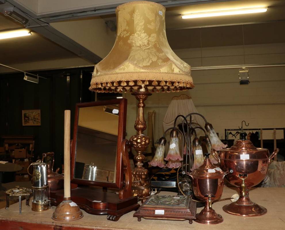 Lot 1070 - 19th century copper including two hot water urns, two toilet mirrors, two table lamps, a miners...
