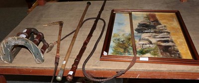 Lot 1071 - Musgraves patent bridle rack; two walking canes; two riding crops/whips and a framed oil sketch...