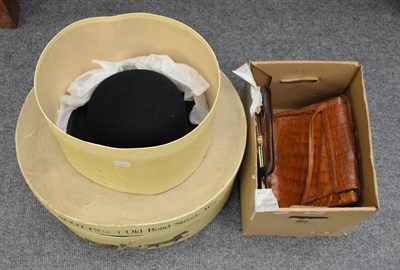 Lot 1080 - A bowler hat and lady's hat in two hat boxes; and three crocodile handbags