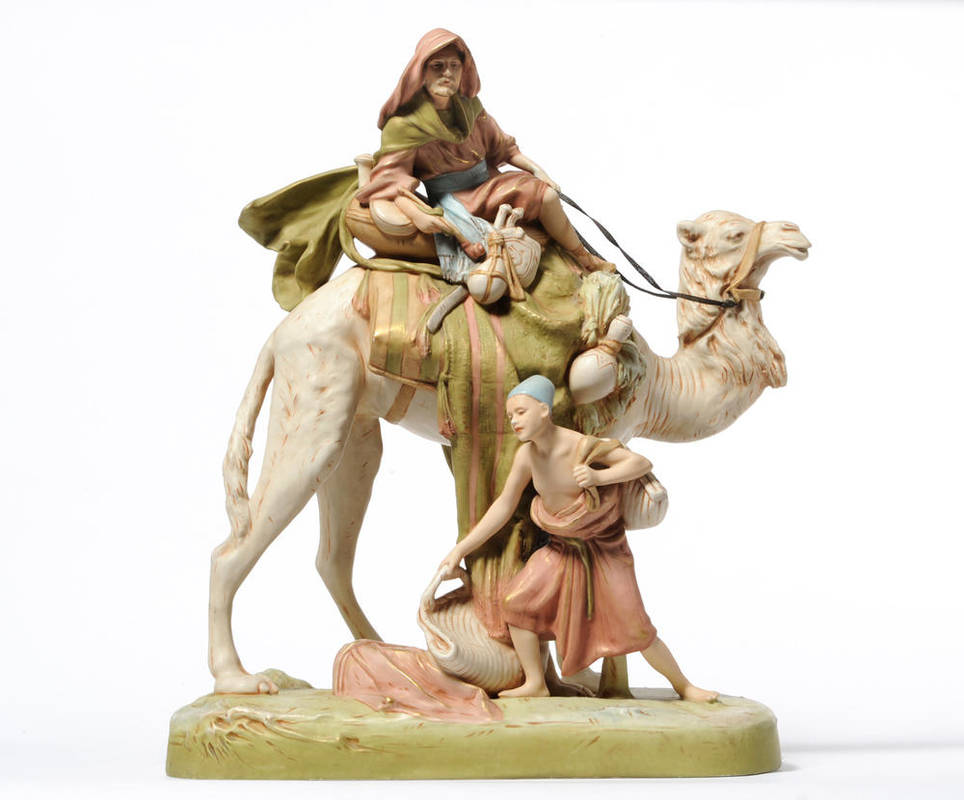 Lot 224 - A Royal Dux Bisque Porcelain Figure Group, 20th century, as a bearded figure in Arabic costume...