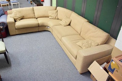 Lot 1148 - A corner sofa upholstered in oatmeal fabric