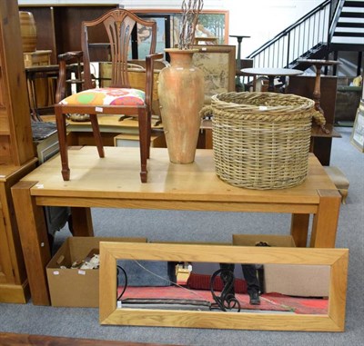 Lot 1157 - An oak dining table; an oak framed mirror; a wicker log basket; a decorative vase and a...