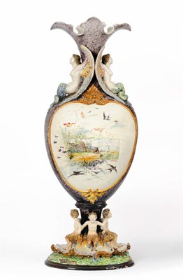 Lot 227 - A Monumental Faience Vase, circa 1870, in Renaissance style, the shaped flared trumpet neck flanked