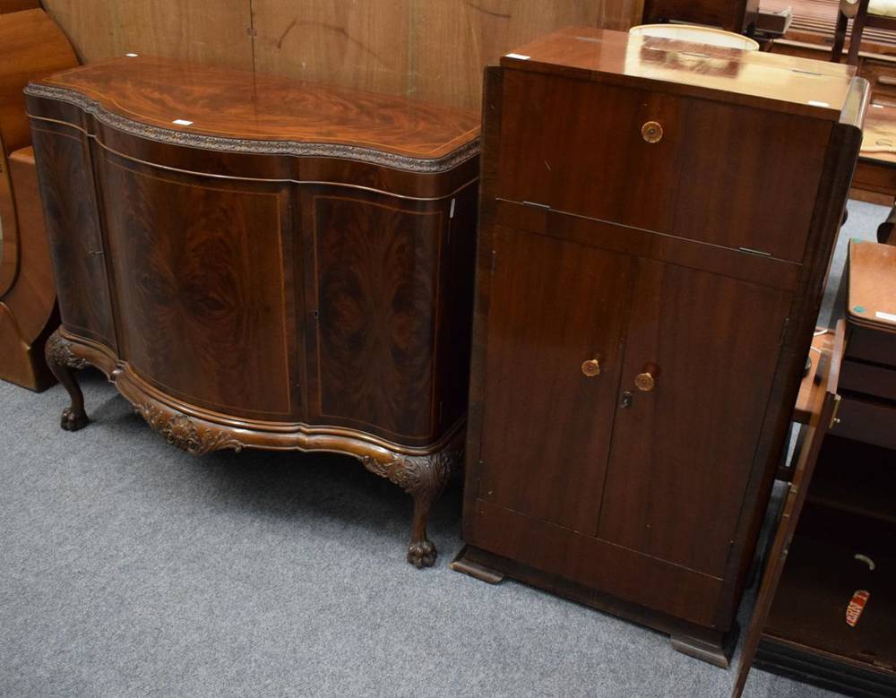 Lot 1174 - A flame mahogany bow fronted sideboard; and a 1940s Art Deco walnut veneer cocktail cabinet