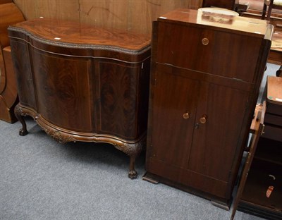 Lot 1174 - A flame mahogany bow fronted sideboard; and a 1940s Art Deco walnut veneer cocktail cabinet