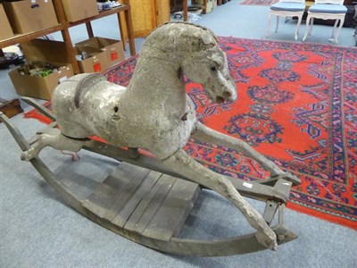Lot 1184 - A carved rocking horse, circa 1900, in need of restoration