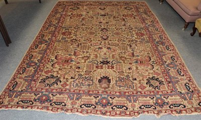 Lot 1187 - Tabriz carpet, Persian Azerbaijan, the cream field of angular vines and stylised palmettes enclosed