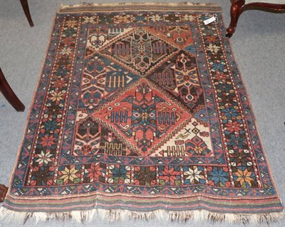 Lot 1189 - Afshar rug, South East iran, the diamond lattice field of stylised plants and tribal motifs...