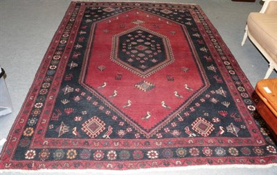 Lot 1191 - Luri Carpet, the raspberry field centred by a lozenge medallion framed by narrow floral...