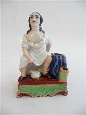 Lot 229 - A French Porcelain Figural Inkwell, circa 1860, as a lady with a chamber pot squatting to...