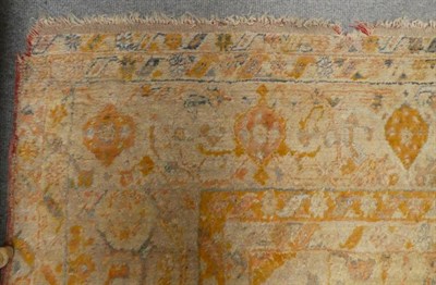 Lot 1197 - Anatolian Carpet, possibly Borlu, the ivory field with three medallions framed by spandrels and...