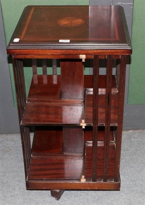 Lot 1202 - An Edwardian style mahogany inlaid revolving bookcase