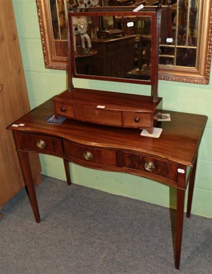 Lot 1206 - George III mahogany serpentine shaped side table and a mahogany bow fronted dressing table mirror