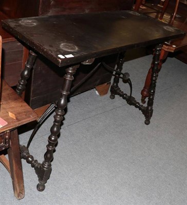 Lot 1223 - A 17th century style Spanish side table with turned legs joined by a metal support, 123cm by...