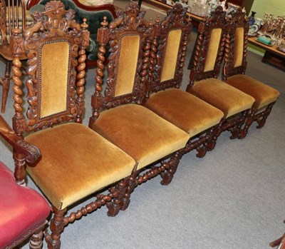 Lot 1241 - Set of five Victorian carved oak dining chairs, in the Carolean style, recovered in yellow velvet