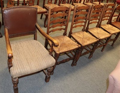 Lot 1247 - Set of four ash rush seated ladder back chairs and an early 20th century oak open armchair (5)