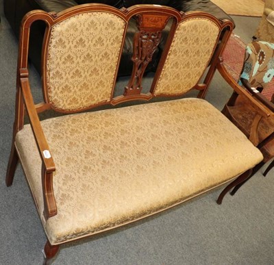Lot 1251 - A late Victorian/Edwardian sofa upholstered in cream fabric