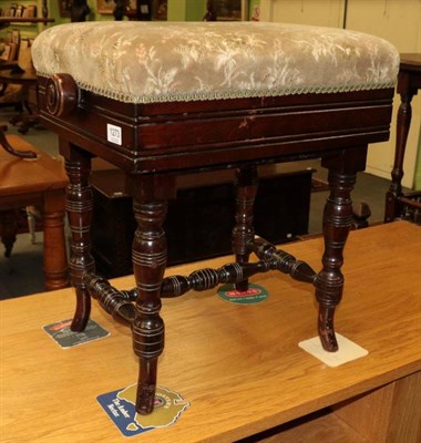 Lot 1273 - An oak adjustable piano stool, on turned supports, stamped to underside 'H&AG'?? Co Ltd' to...