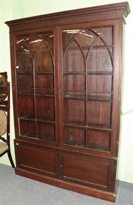 Lot 1283 - A 19th century mahogany glazed bookcase, with a Greek key dentil cornice and arched glazed...