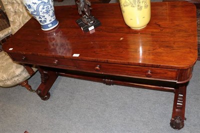 Lot 1294 - Early Victorian rosewood library table with two drawers raised on scrolled end supports