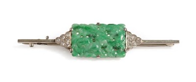 Lot 2 - An Art Deco Jade and Diamond Bar Brooch, the oblong pierced jade depicting fruits, with a...