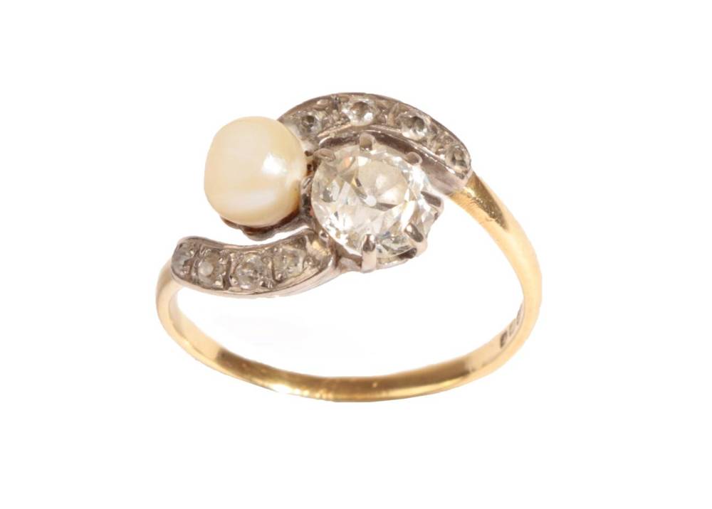 Lot 14 - An 18 Carat Gold Cultured Pearl and Diamond Two Stone Twist Ring, in claw settings with old cut...