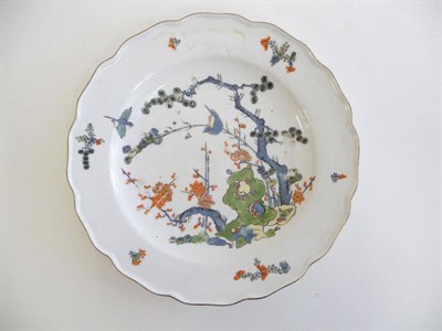 Lot 243 - A Meissen Porcelain Dinner Plate, circa 1750, painted in the Kakiemon palette with birds...