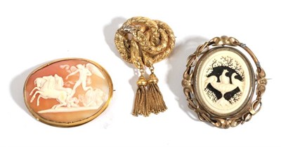 Lot 24 - A Carved Ivory Brooch, depicting three birds at a bath, in a swivel frame (a.f.), A Victorian...