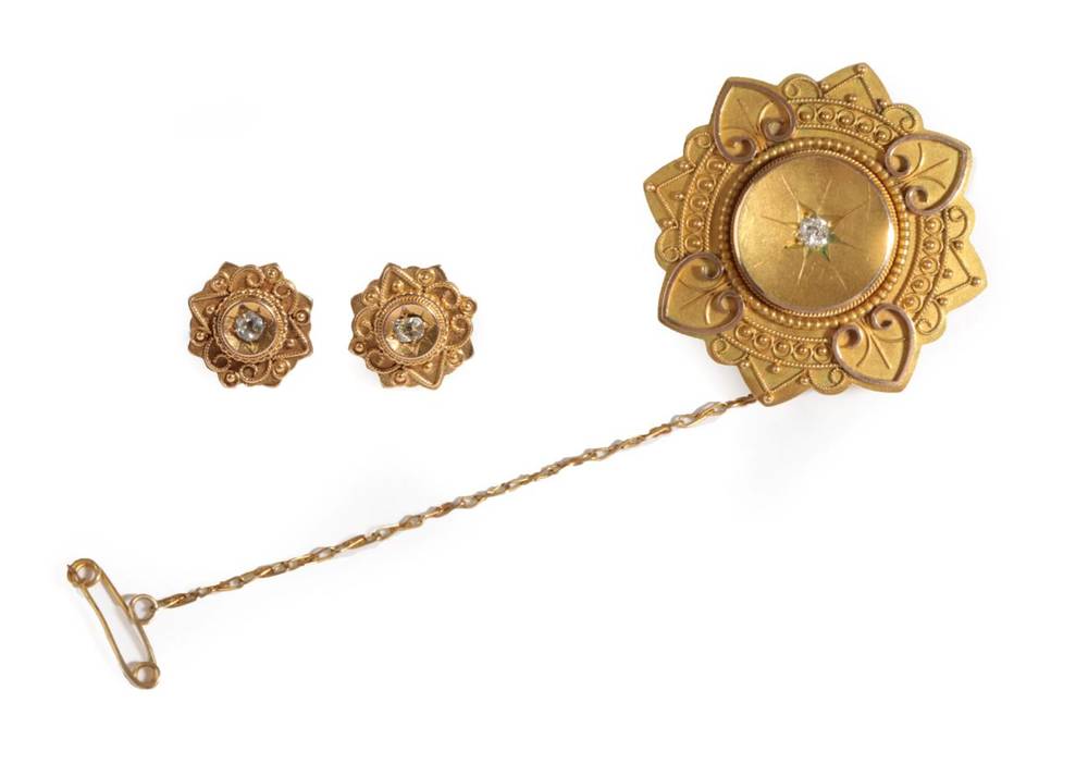 Lot 29 - A Victorian 15 Carat Gold Brooch and Earring Set, the brooch with a central old cut diamond...