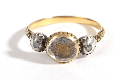 Lot 35 - A Mourning Ring, circa 1800, a faceted rock crystal cover entwined hair and a monogram, in a yellow