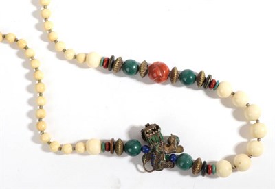 Lot 40 - A Chinese Ivory, Coral and Enamel Necklace, graduated round ivory beads, a shaped coral and...