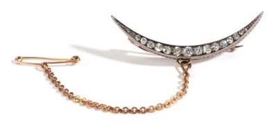 Lot 44 - A Diamond Crescent Brooch, the graduated old cut diamonds in white claws, total estimated...
