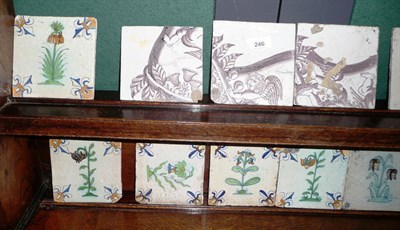 Lot 246 - A Group of Six Delft Tiles, 18th century, painted in manganese with cupids and foliage as part...