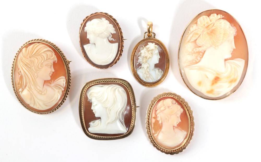 Lot 52 - A Cameo Brooch, depicting three figures at a lyre, within an oval rope twist frame, measures...
