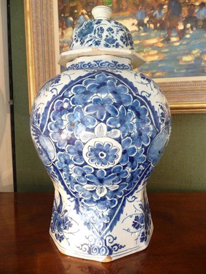 Lot 247 - A Dutch Delft Octagonal Baluster Vase and Cover, late 18th century, painted in blue with ogee...