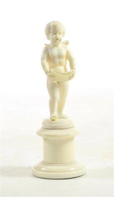 Lot 60 - A Carved Ivory Figure of a Singing Putto, probably Dieppe, late 19th century, standing holding...