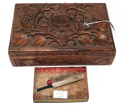 Lot 97 - ~ A Carved Wood Box and Cover, 20th century, with crest on a ground of fruiting branches; and A...