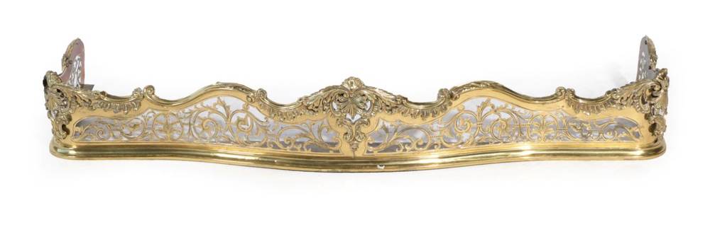 Lot 101 - ~ A Victorian Engraved Brass and Foliate Decorated Serpentine Shaped Fire Curb, with moulded...