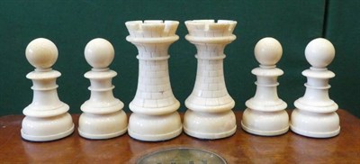 Lot 107 - An English Stained and Natural Ivory Chess Set, early 19th century, kings 12cm high in a...