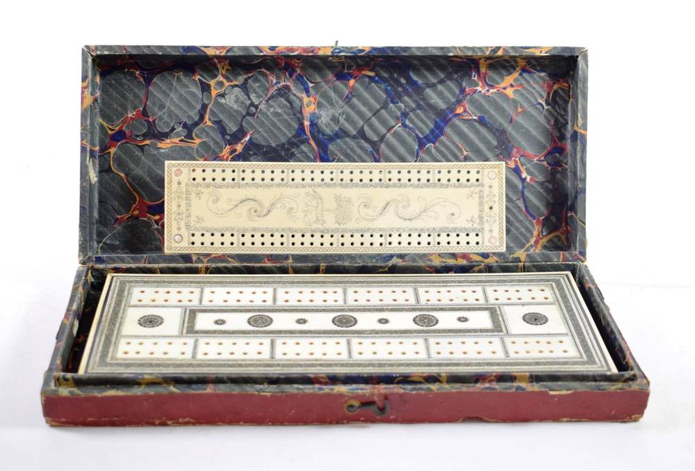 Lot 109 - An Anglo-Indian Ivory and Sedeli Cribbage Board, mid 19th century, with foliate decoration on...