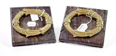 Lot 114 - A Pair of Bronze Furniture Mounts, cast as foliate roundels, 14.5cm wide, mounted on wooden blocks