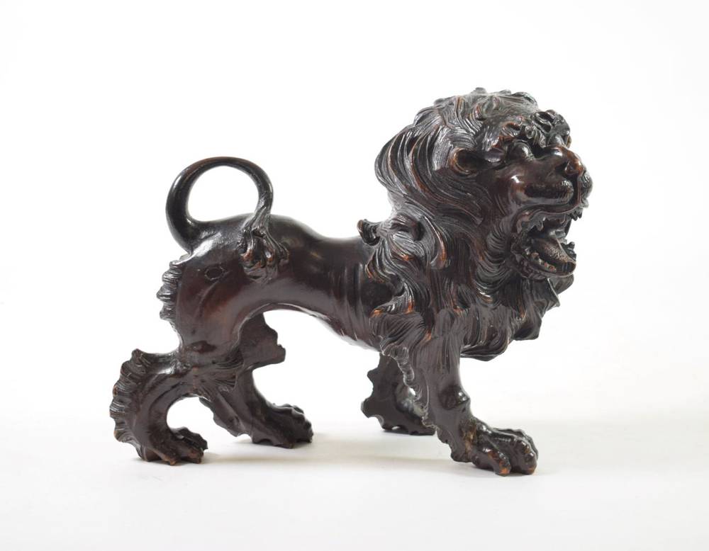 Lot 127 - ^ A Carved and Patinated Wood Figure of a Lion, in Italian Renaissance style, standing...