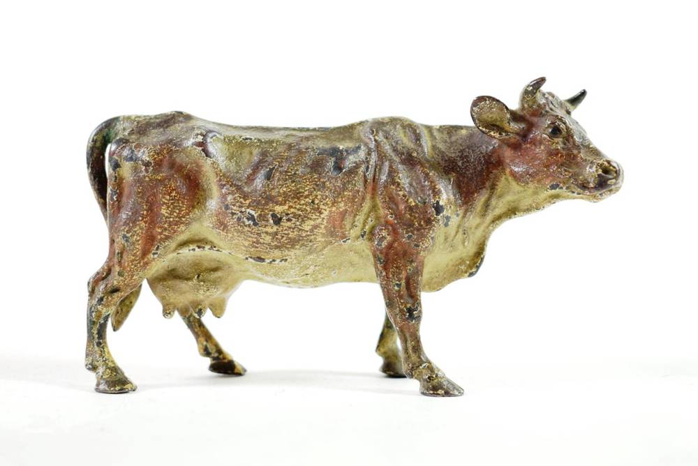 Lot 138 - An Austrian Cold Painted Bronze Figure of a Cow, early 20th century, naturalistically modelled...