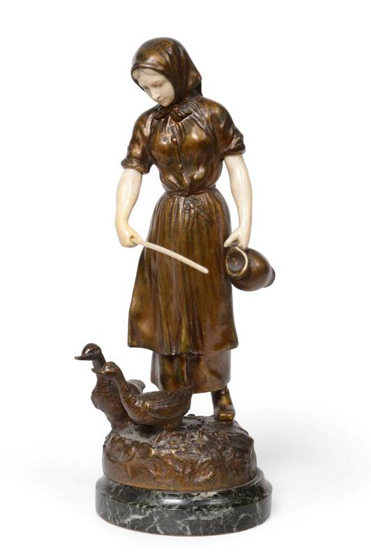 Lot 146 - Henryk Kossowski: A Bronze and Ivory Figure of a Girl, in traditional costume, two ducks at her...