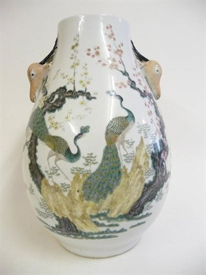 Lot 256 - A Chinese Porcelain Pear Shaped Vase, late 19th/20th century, with deer's head handles, painted...