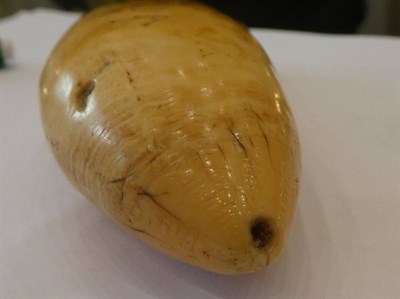 Lot 163 - A Scrimshaw Whale's Tooth, 19th century, inscribed VATOA, 13cm long
