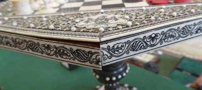 Lot 172 - A Vizagapatam Natural and Stained Ivory Miniature Games Table, mid 19th century, of octagonal...