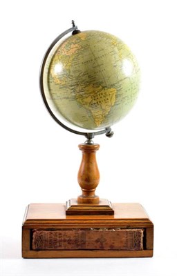 Lot 174 - A Phillips 6'' Terrestrial Globe, on an oak stand with a Handy Volume Atlas of the World to the...