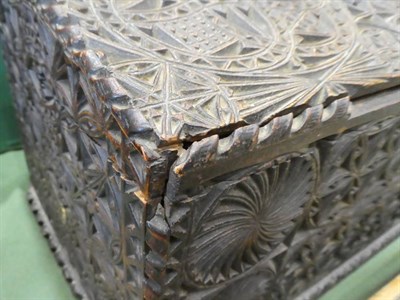 Lot 181 - A Chip Carved Oak Casket, in 17th century style, the hinged sloping top enclosing a gilt metal coat
