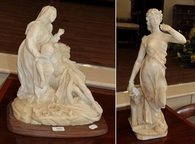 Lot 183 - Italian School (19th century): An Alabaster Pieta, carved with Mary standing beside the fallen...